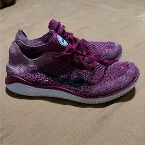 Pink Nike Fly Knit Sneakers